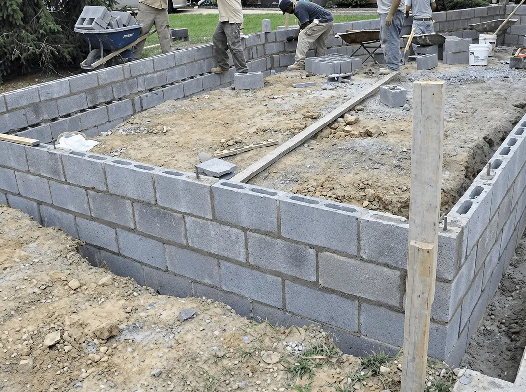 Professionals building a foundation with blocks in San Diego, CA