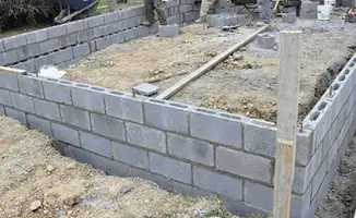 Professionals building a foundation with blocks in San Diego, CA