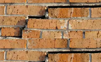 Brick wall with serious structural damage in San Diego, CA